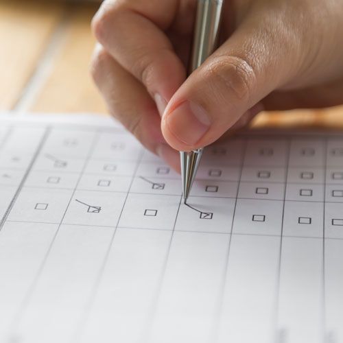 Man having trouble staying awake in front of computer